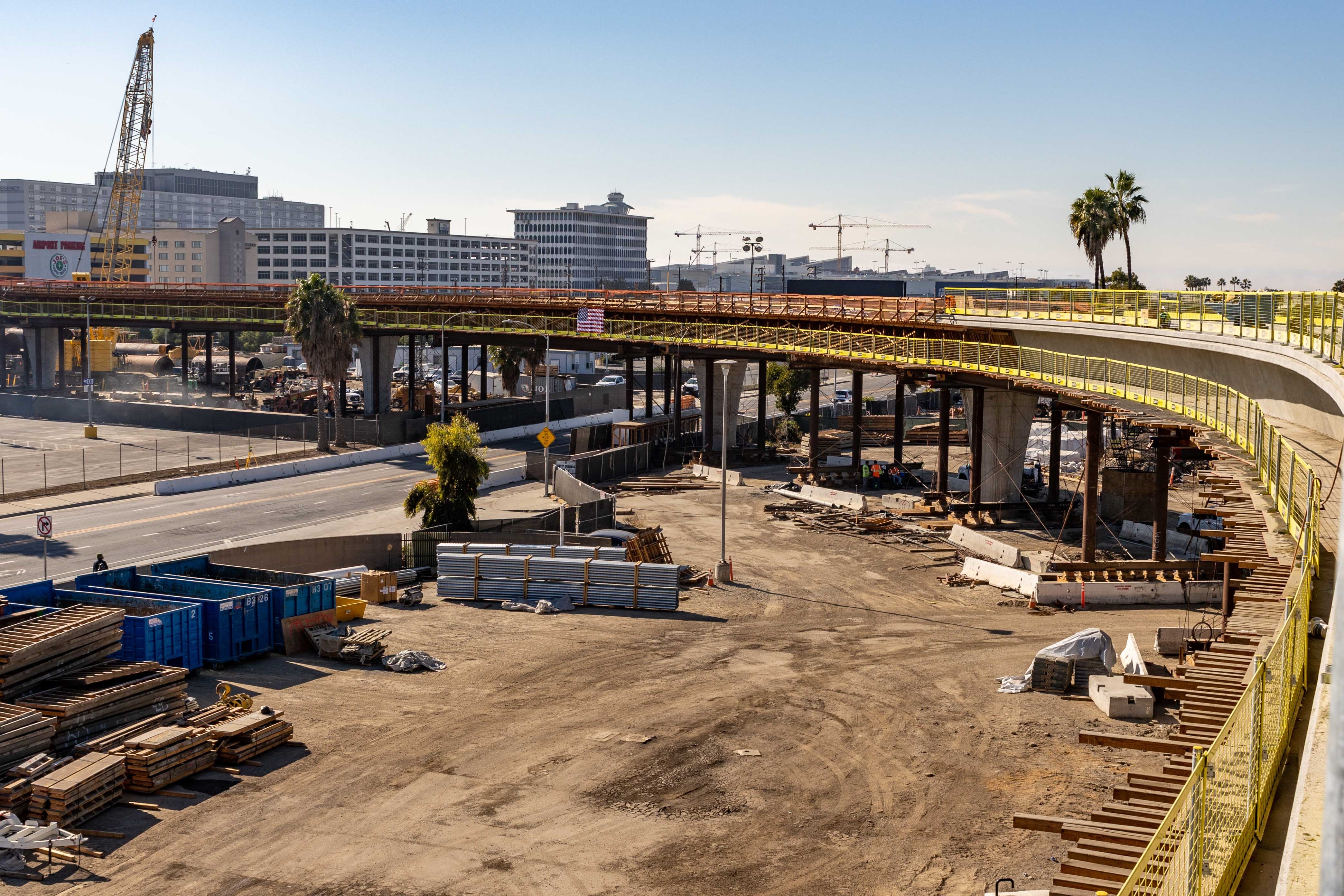 APM guideway construction advances across the 96th Street roadway as it approaches Century Boulevard.