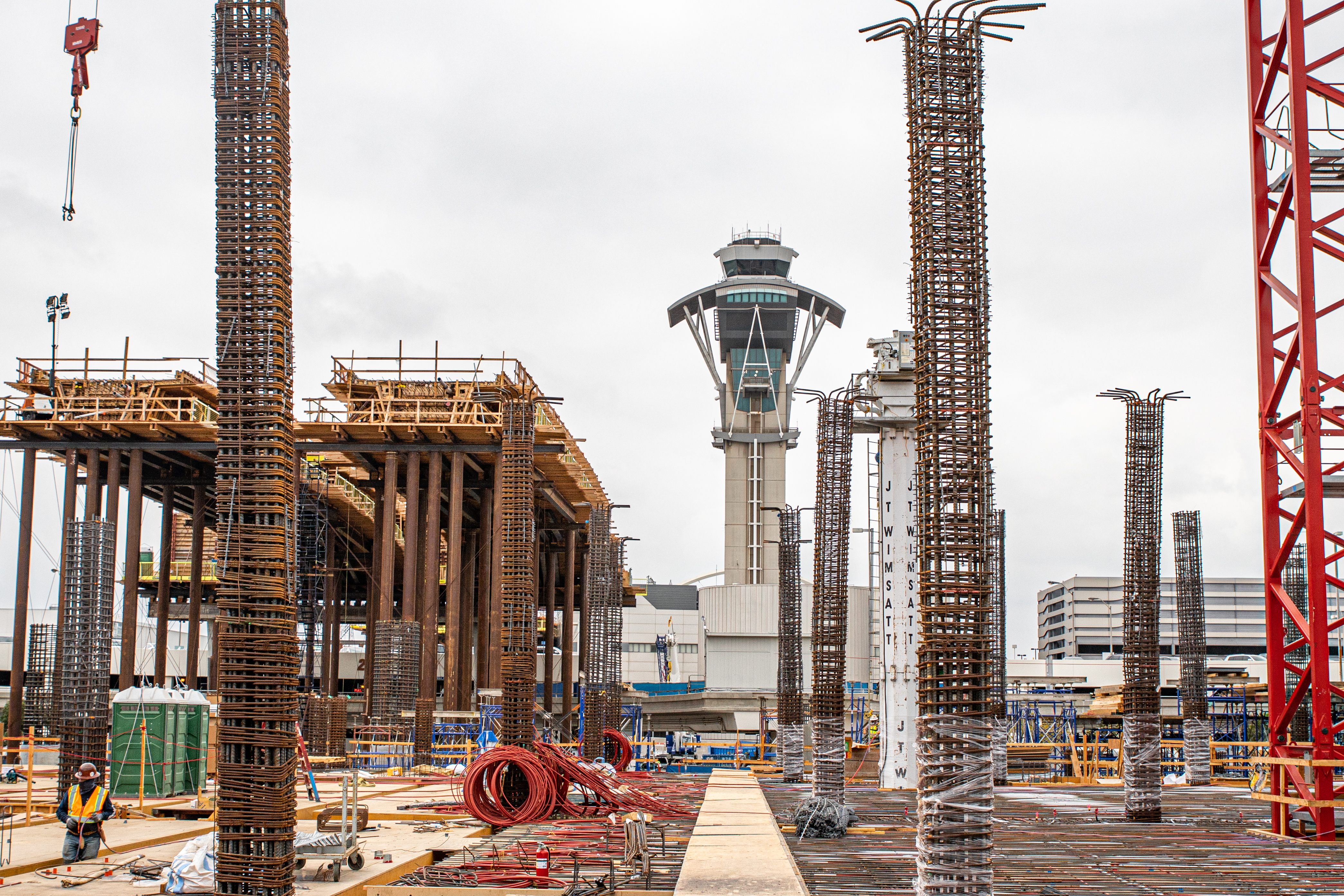 Crews work to prepare for the next concrete placement at the parking structure that will service the future West Central Terminal Area station.