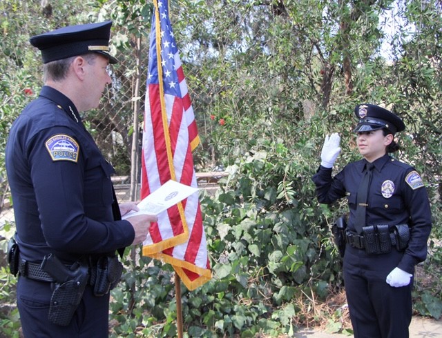 Chief of Airport Police David Maggard swearing in Police Officer Kristin Fuentes