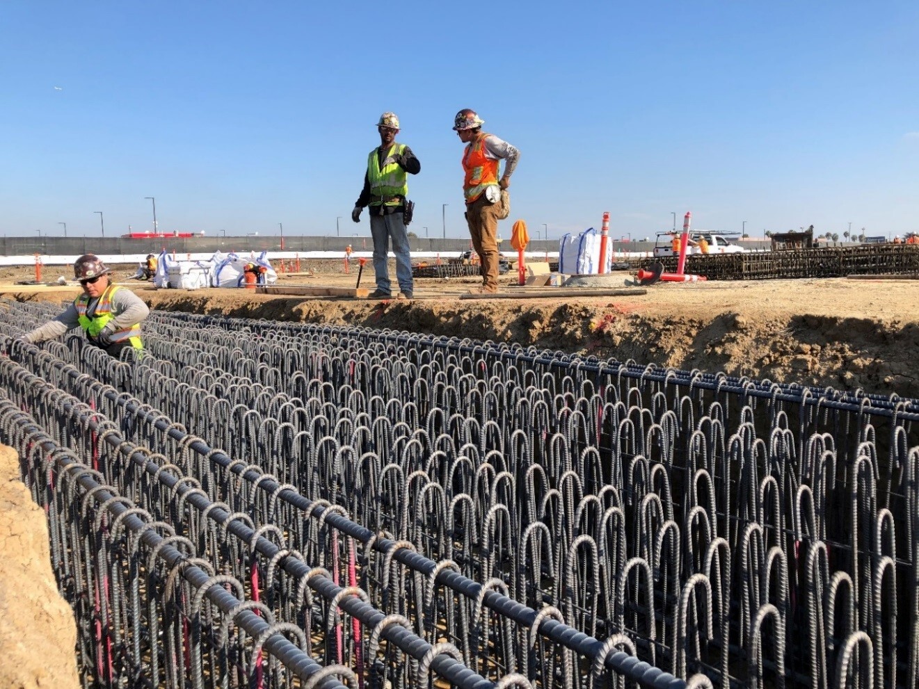 Workers installing reinforcing steel prior to the first concrete pour at the LAX Economy Parking facility (formerly Intermodal Transportation Facility – West) site.