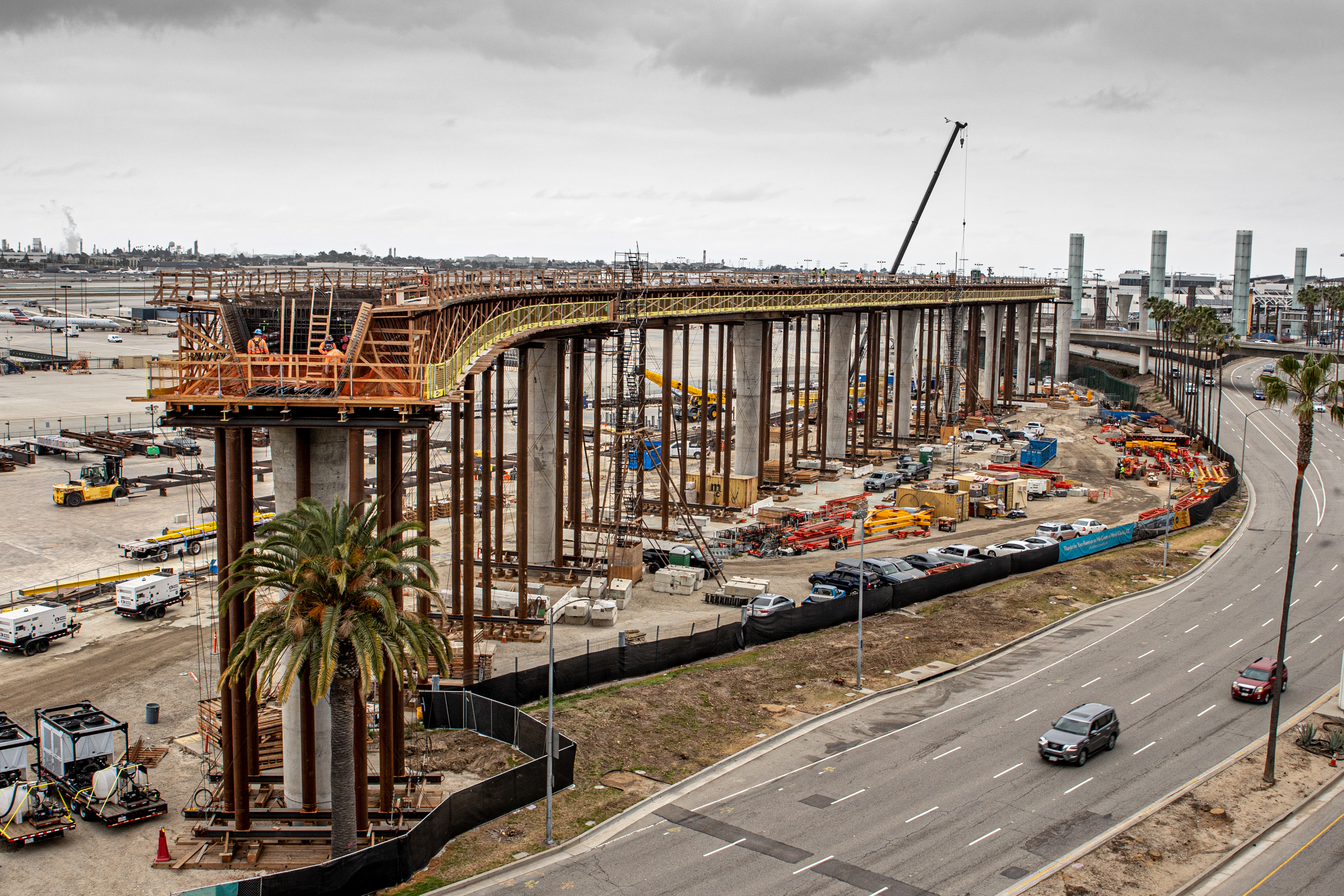 Construction of the Automated People Mover guideway near Century Boulevard advances as the team prepares to span the roadway.