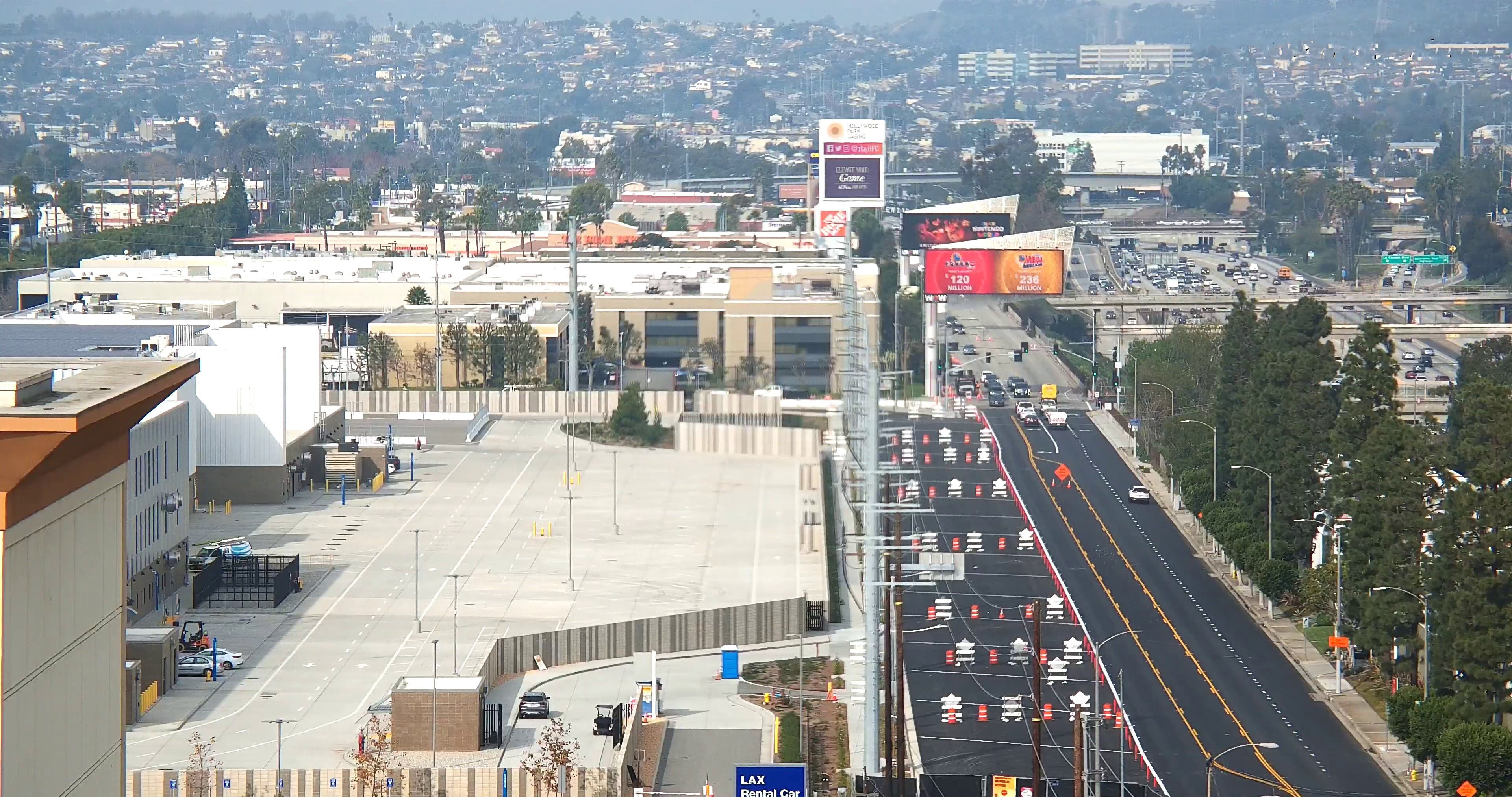 Street widening on La Cienega Boulevard along the eastern edge of the Consolidated Rent-A-Car facility property.